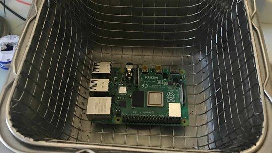 Raspberry Pi 4 Model B in an ultrasonic cleaner full of isopropanol